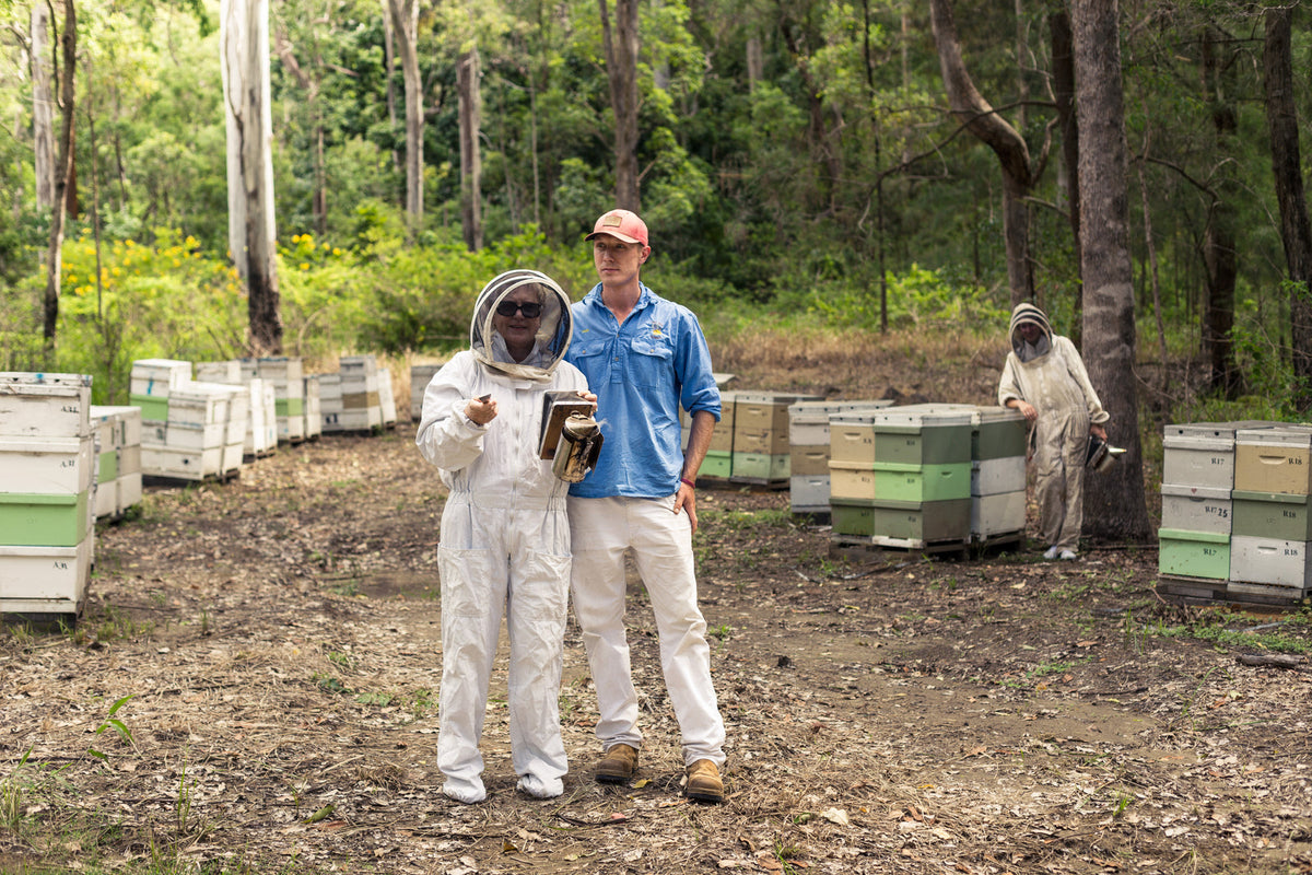 The John & Jill's family at their bushland apiary among the hives